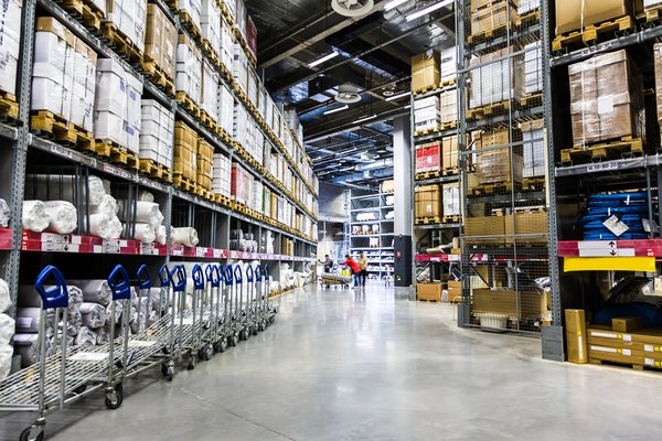 The inside of a warehouse packed with goods.